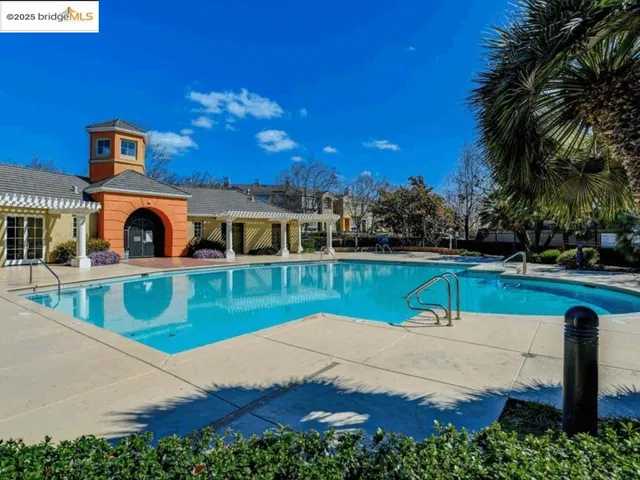 a view of a swimming pool with a patio
