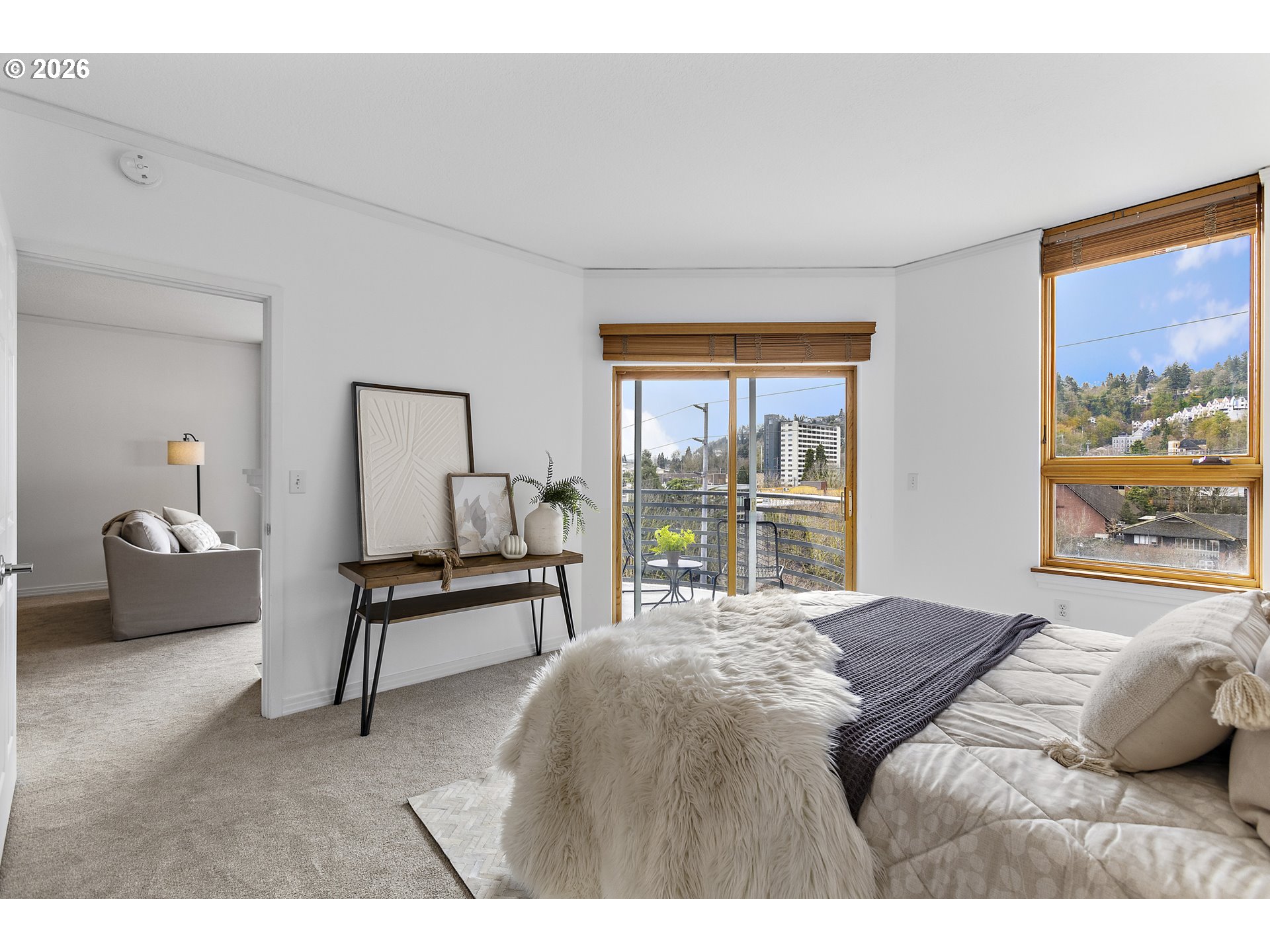 1132 Southwest 19th Avenue, Unit 505 Portland, OR 97205 - Photo 14 of 36 a bedroom with a bed and a large window