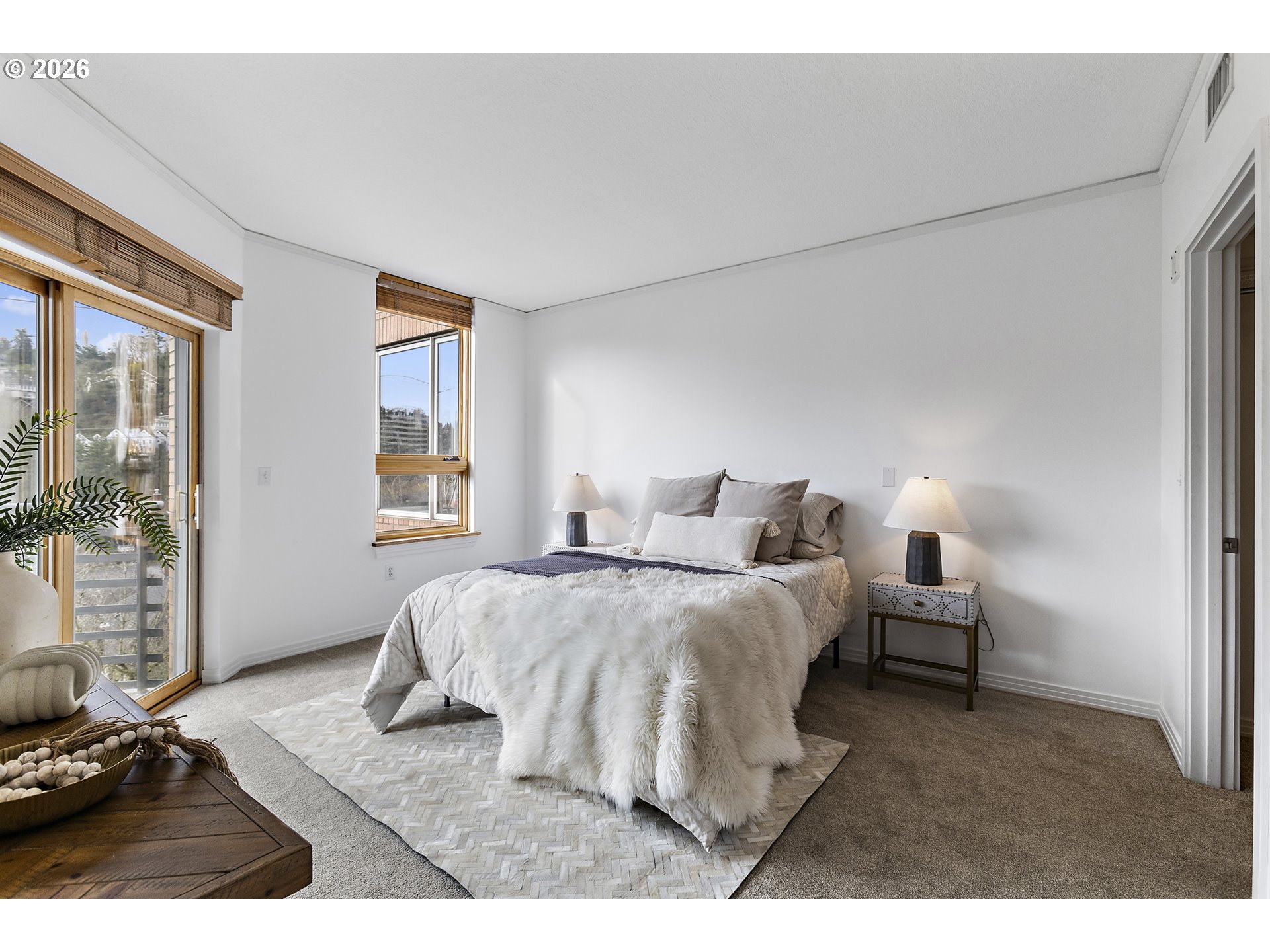 1132 Southwest 19th Avenue, Unit 505 Portland, OR 97205 - Photo 15 of 36 a bedroom with a bed and window