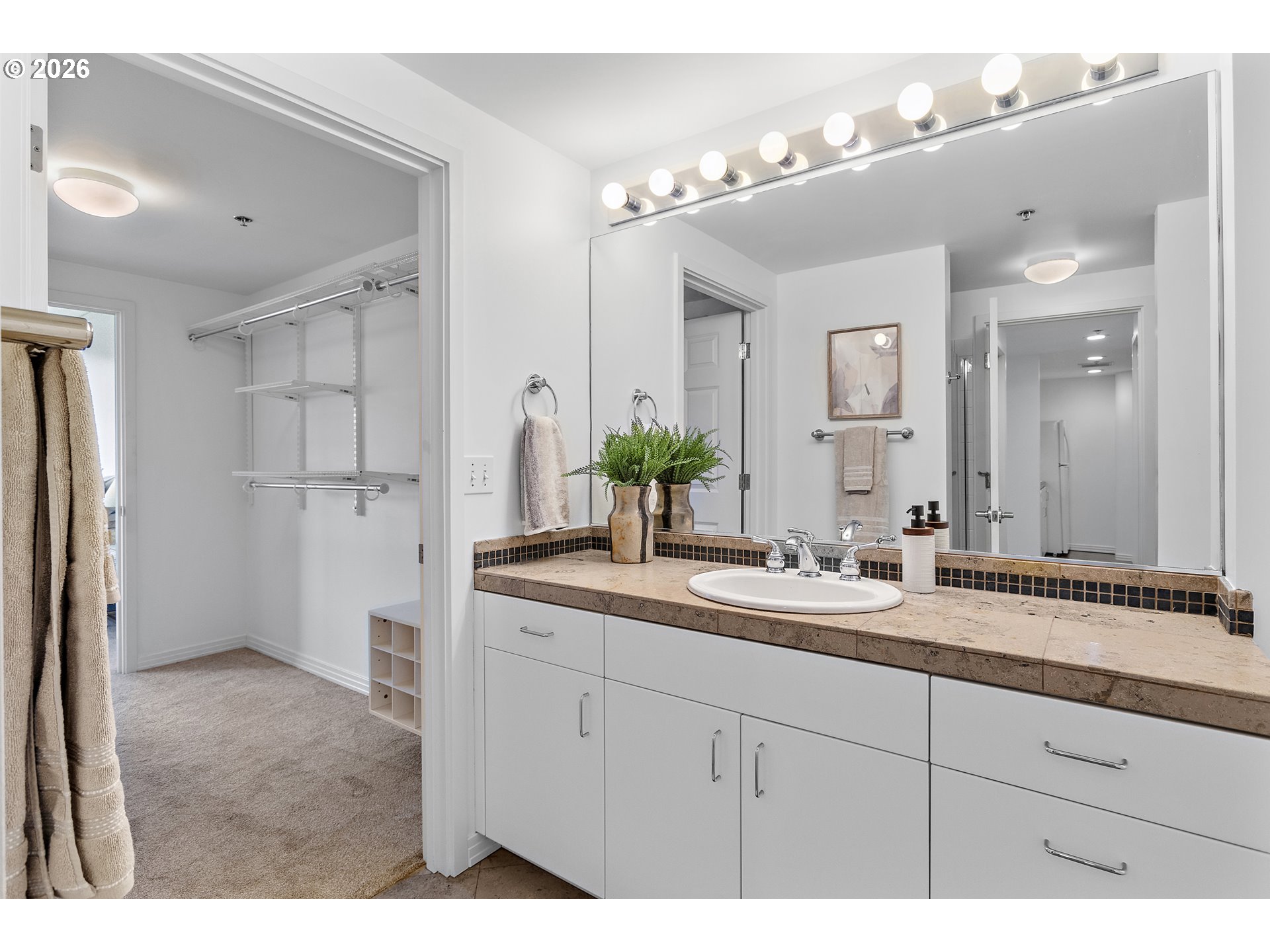 1132 Southwest 19th Avenue, Unit 505 Portland, OR 97205 - Photo 18 of 36 a bathroom with a sink and a mirror