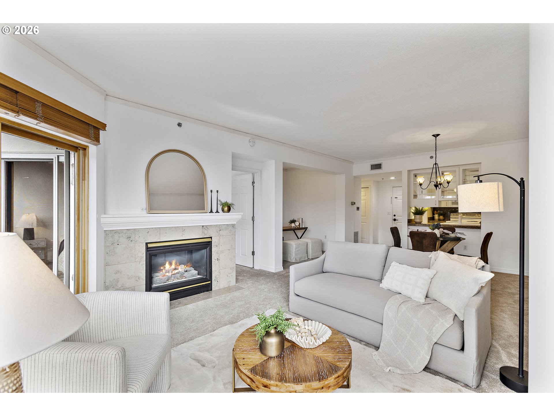 1132 Southwest 19th Avenue, Unit 505 Portland, OR 97205 - Photo 2 of 36 a living room with furniture a fireplace and a table
