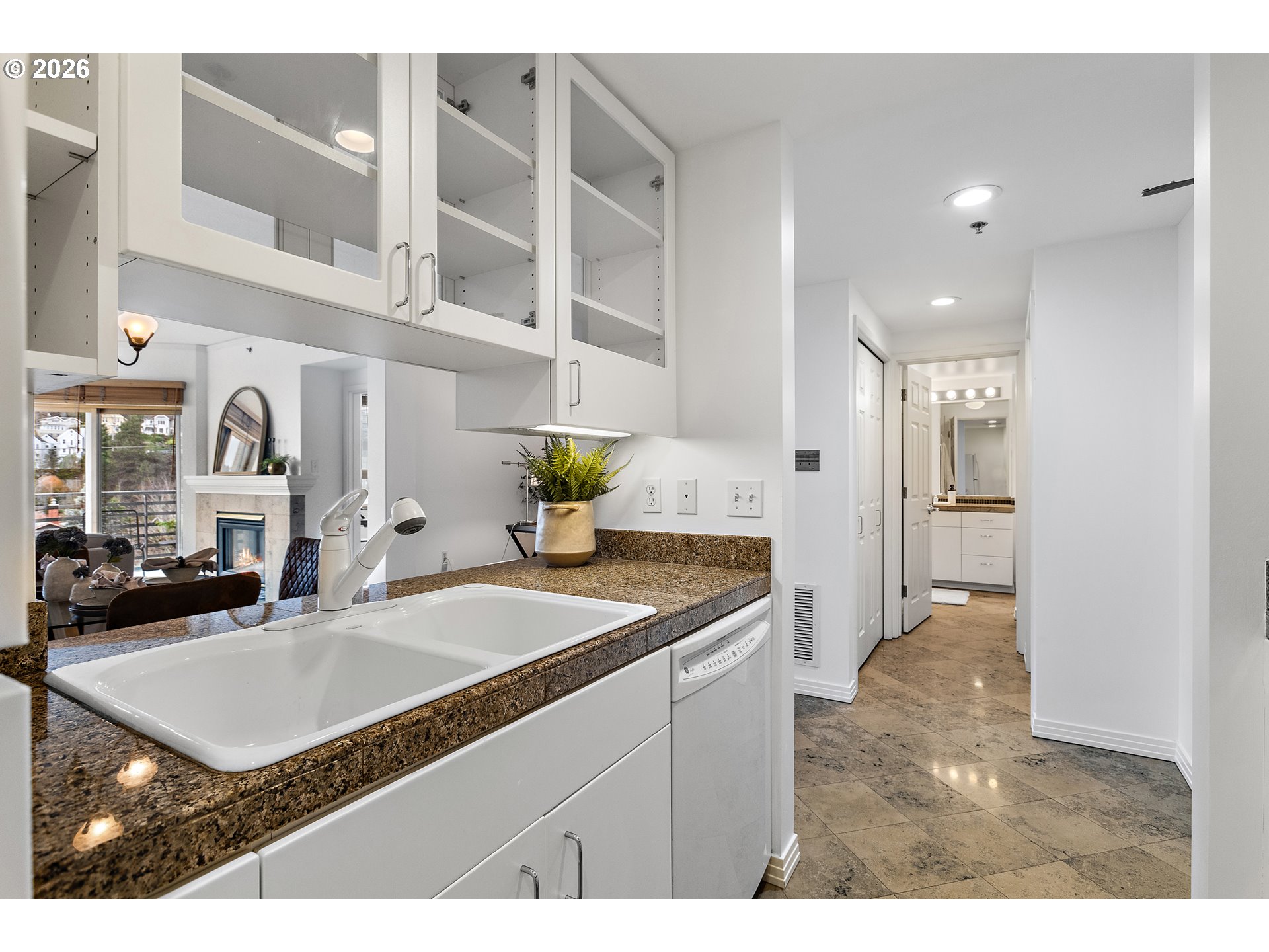 1132 Southwest 19th Avenue, Unit 505 Portland, OR 97205 - Photo 5 of 36 a kitchen with a sink refrigerator and cabinets