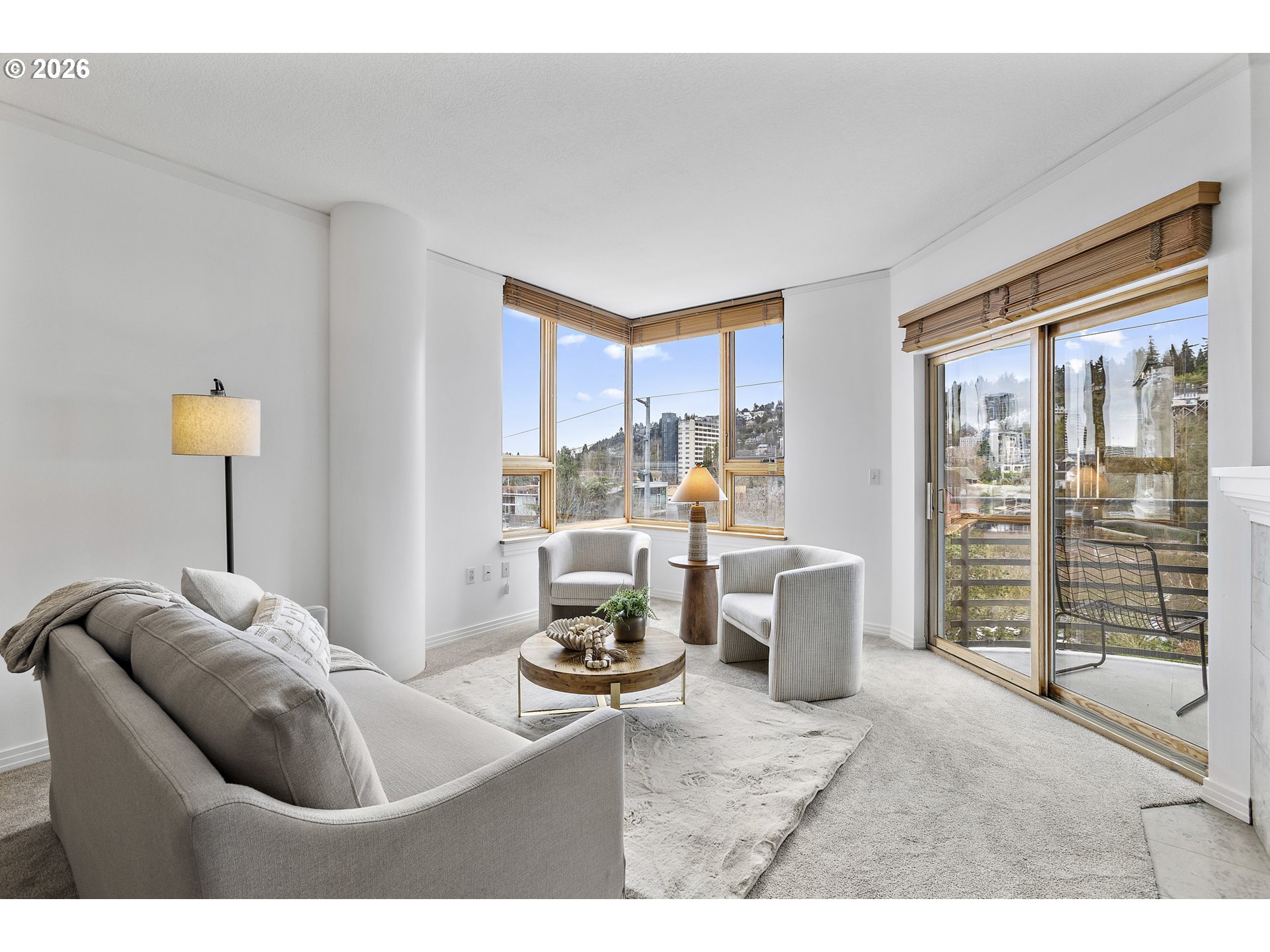 1132 Southwest 19th Avenue, Unit 505 Portland, OR 97205 - Photo 7 of 36 a living room with furniture and a floor to ceiling window