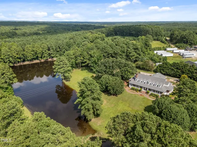an aerial view of ocean yard and residential houses with outdoor space