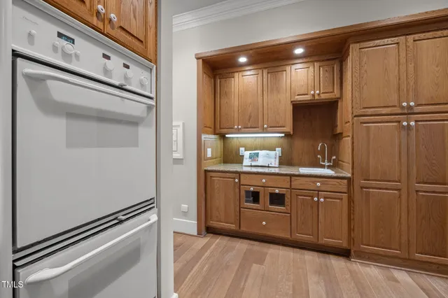 a kitchen with stainless steel appliances a refrigerator and cabinets