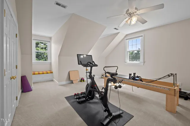 a view of hallway with wooden floor