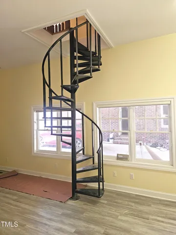 a view of front door of a house with a yard