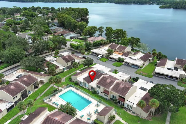 an aerial view of a houses with yard