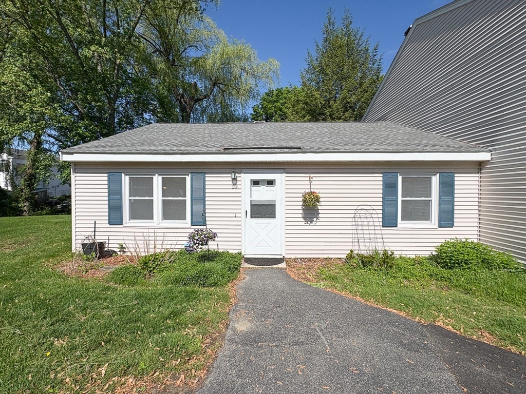 103 Main Street, Unit 10 Pepperell, MA 01463 - Photo 18 of 22 front view of a house with a yard