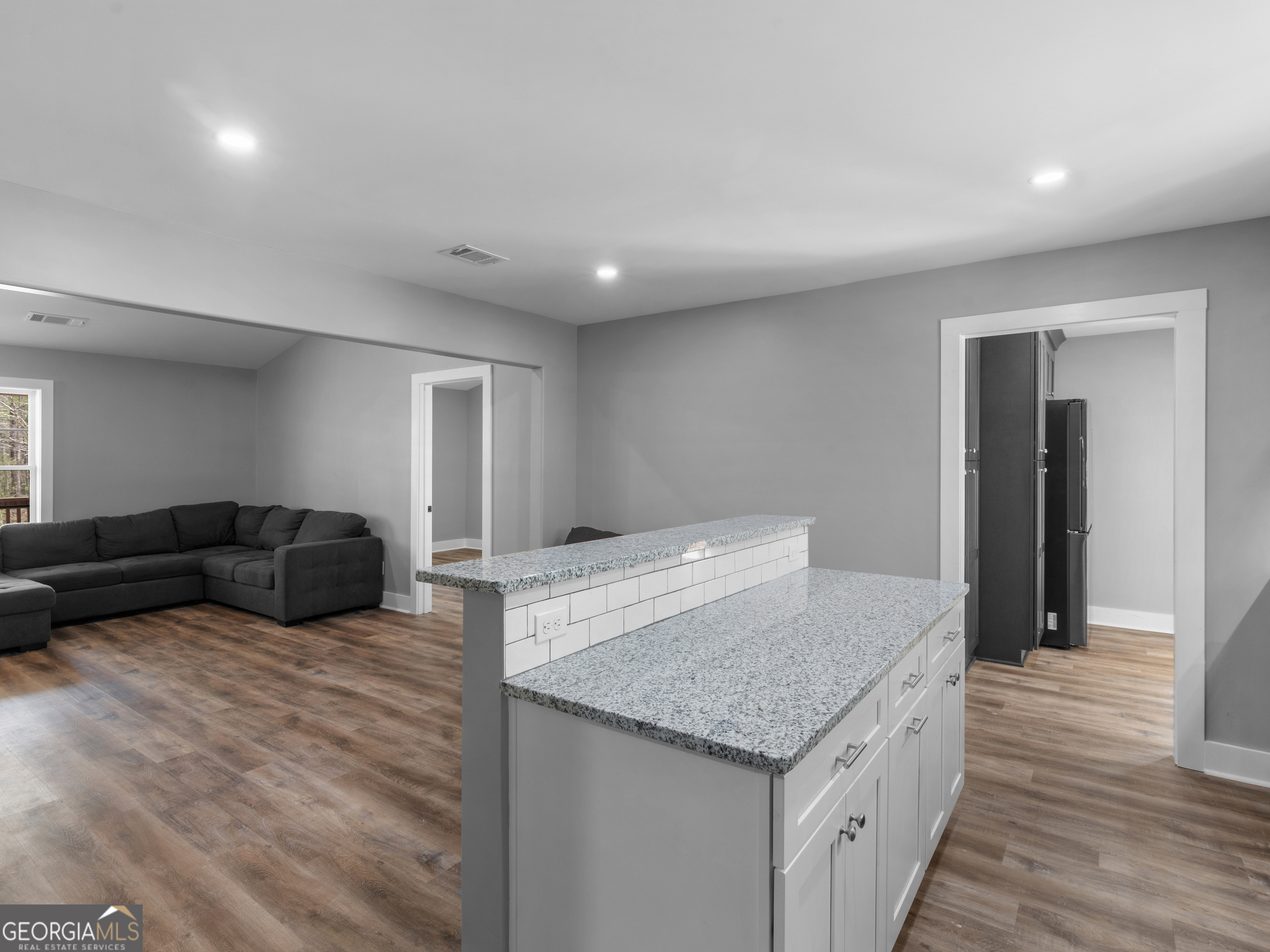 265 Steele Road Griffin, GA 30223 - Photo 13 of 64 a living room with furniture and wooden floor