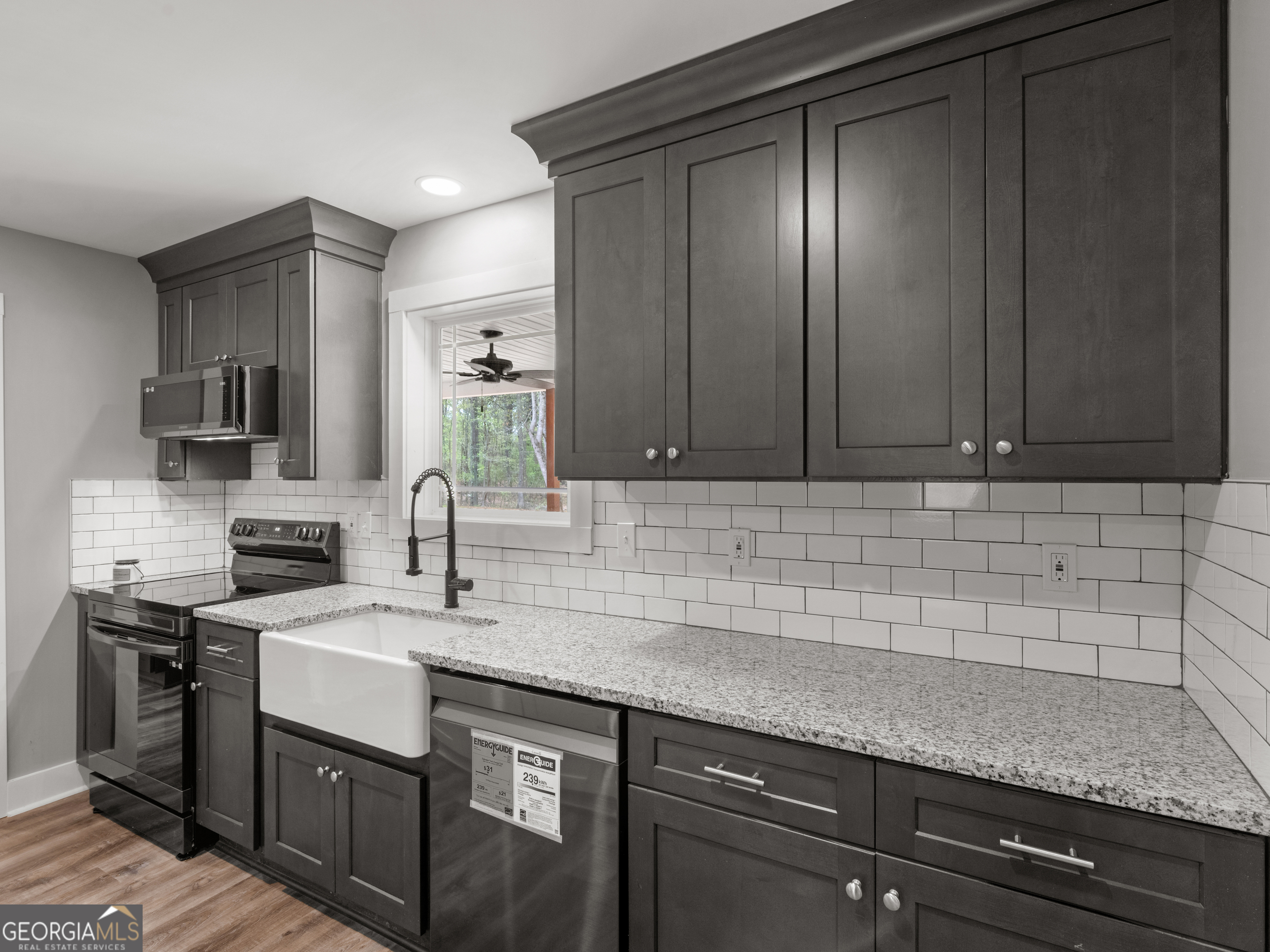 265 Steele Road Griffin, GA 30223 - Photo 14 of 64 a kitchen with a sink and cabinets