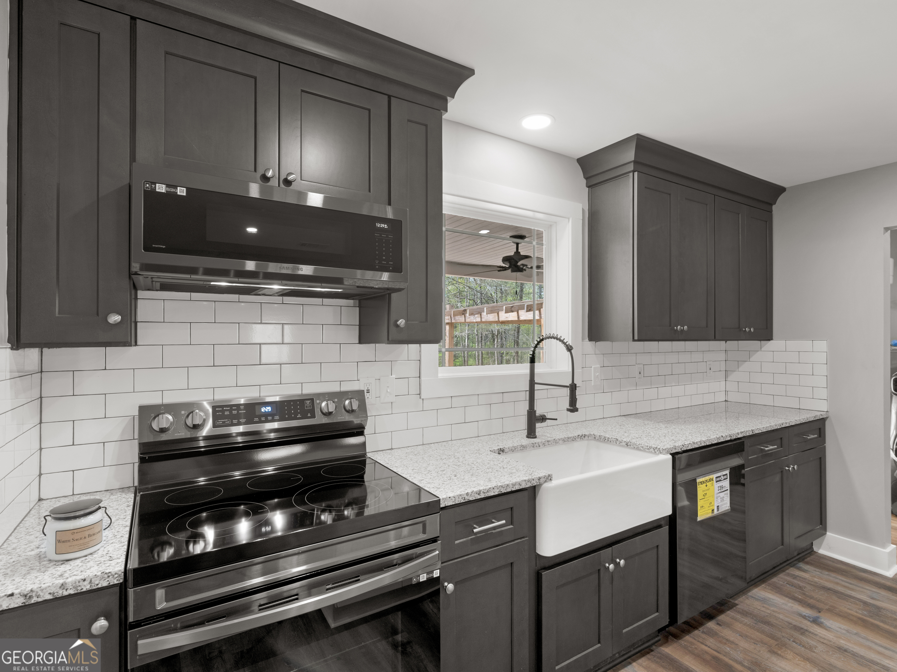 265 Steele Road Griffin, GA 30223 - Photo 15 of 64 a kitchen with a sink and a stove top oven