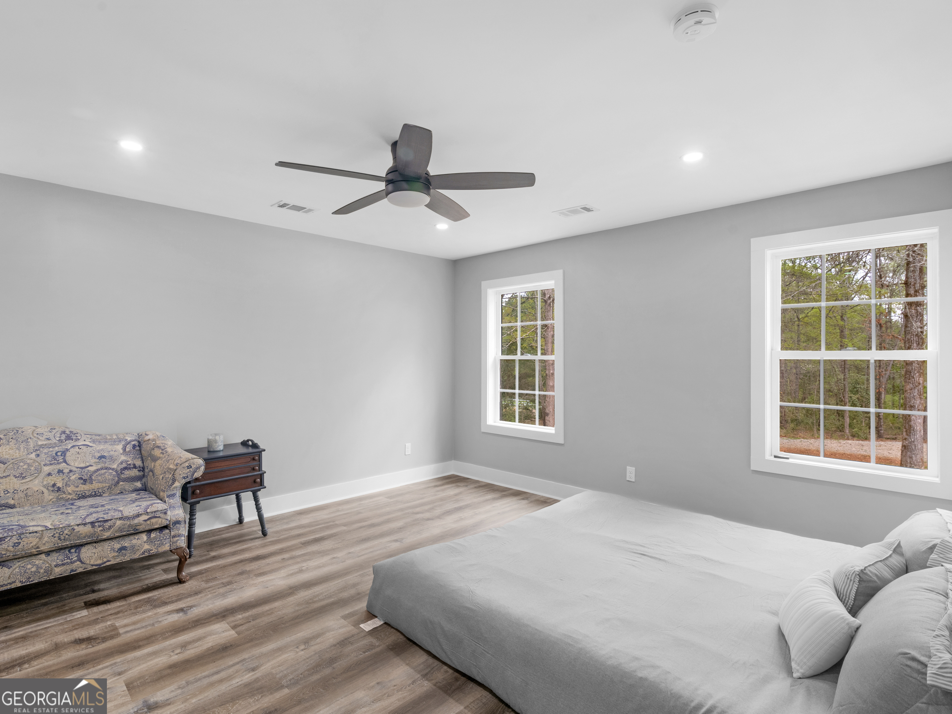 265 Steele Road Griffin, GA 30223 - Photo 26 of 64 a bedroom with a bed and wooden floor