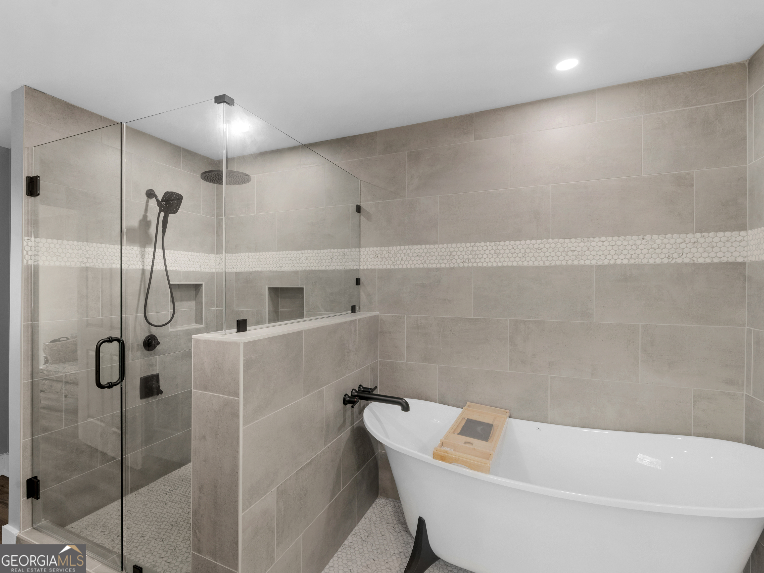 265 Steele Road Griffin, GA 30223 - Photo 30 of 64 a bathroom with a bathtub and shower