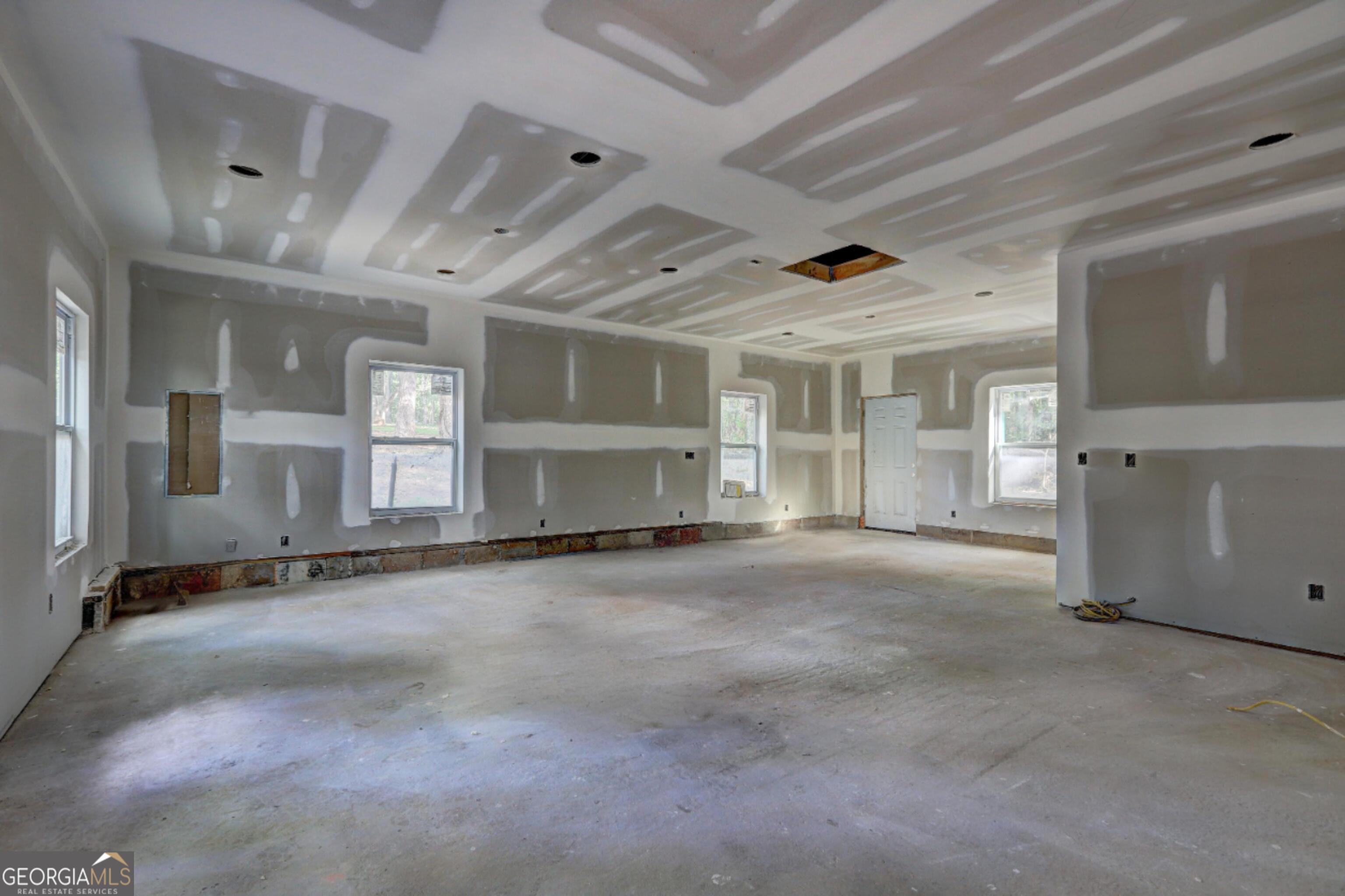 265 Steele Road Griffin, GA 30223 - Photo 39 of 64 a view of empty room with wooden floor
