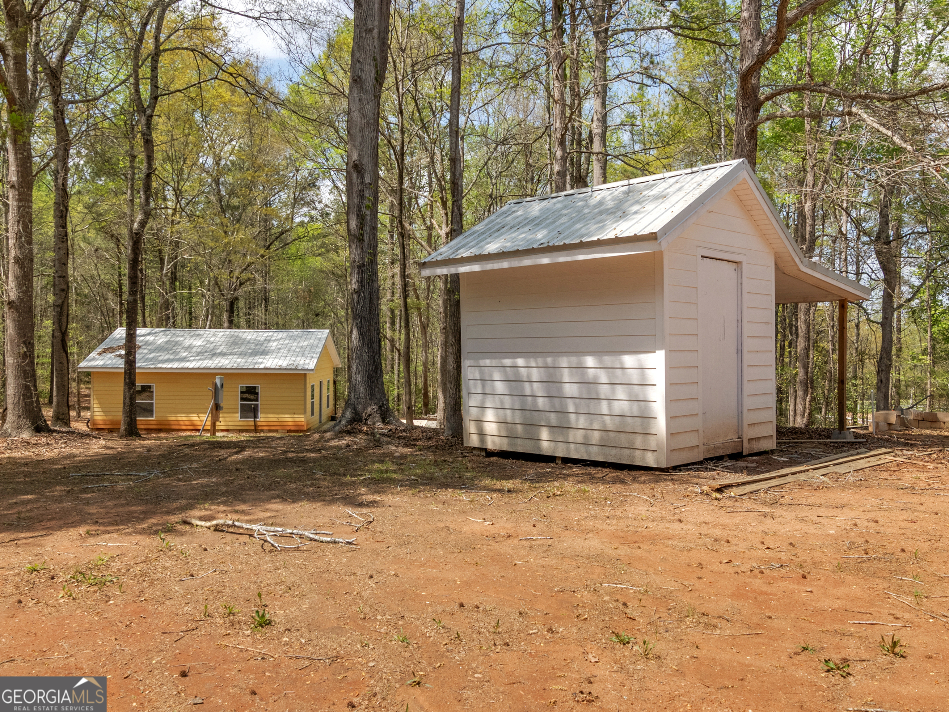 265 Steele Road Griffin, GA 30223 - Photo 49 of 64 a view of a house with a yard and garage