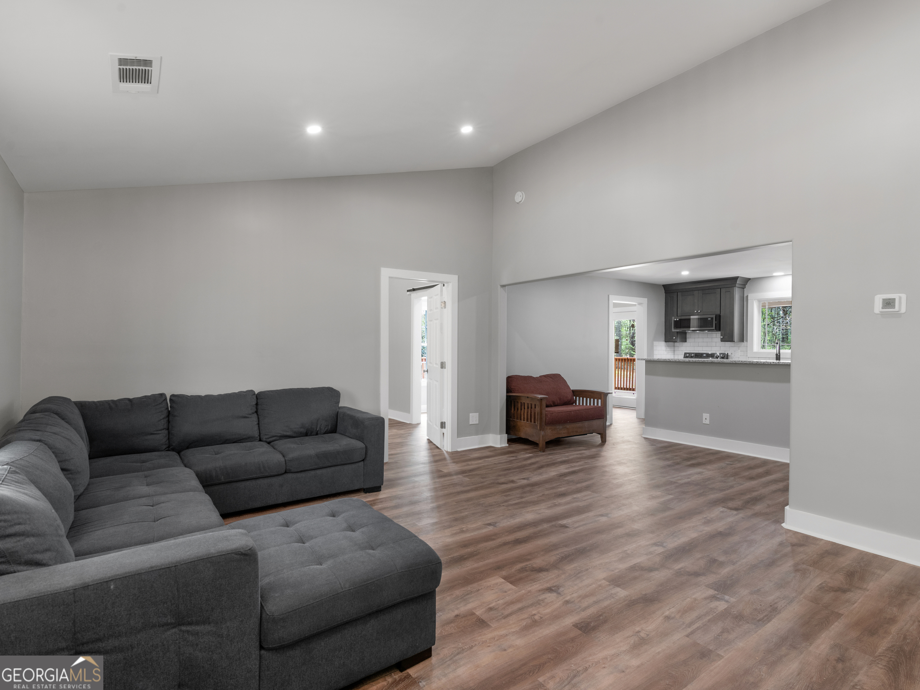 265 Steele Road Griffin, GA 30223 - Photo 5 of 64 a living room with furniture and a flat screen tv