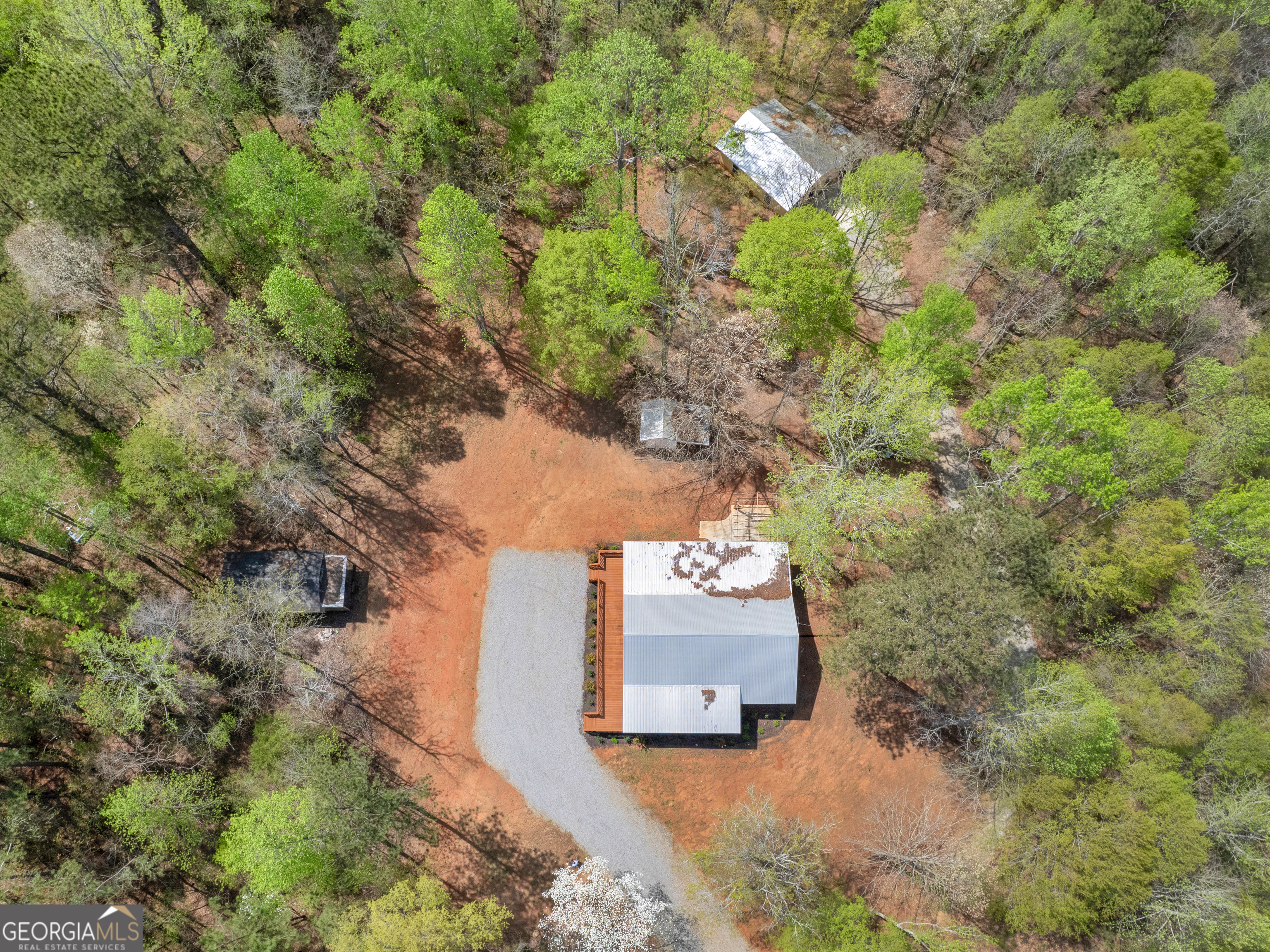 265 Steele Road Griffin, GA 30223 - Photo 56 of 64 an aerial view of a house with a yard and large trees