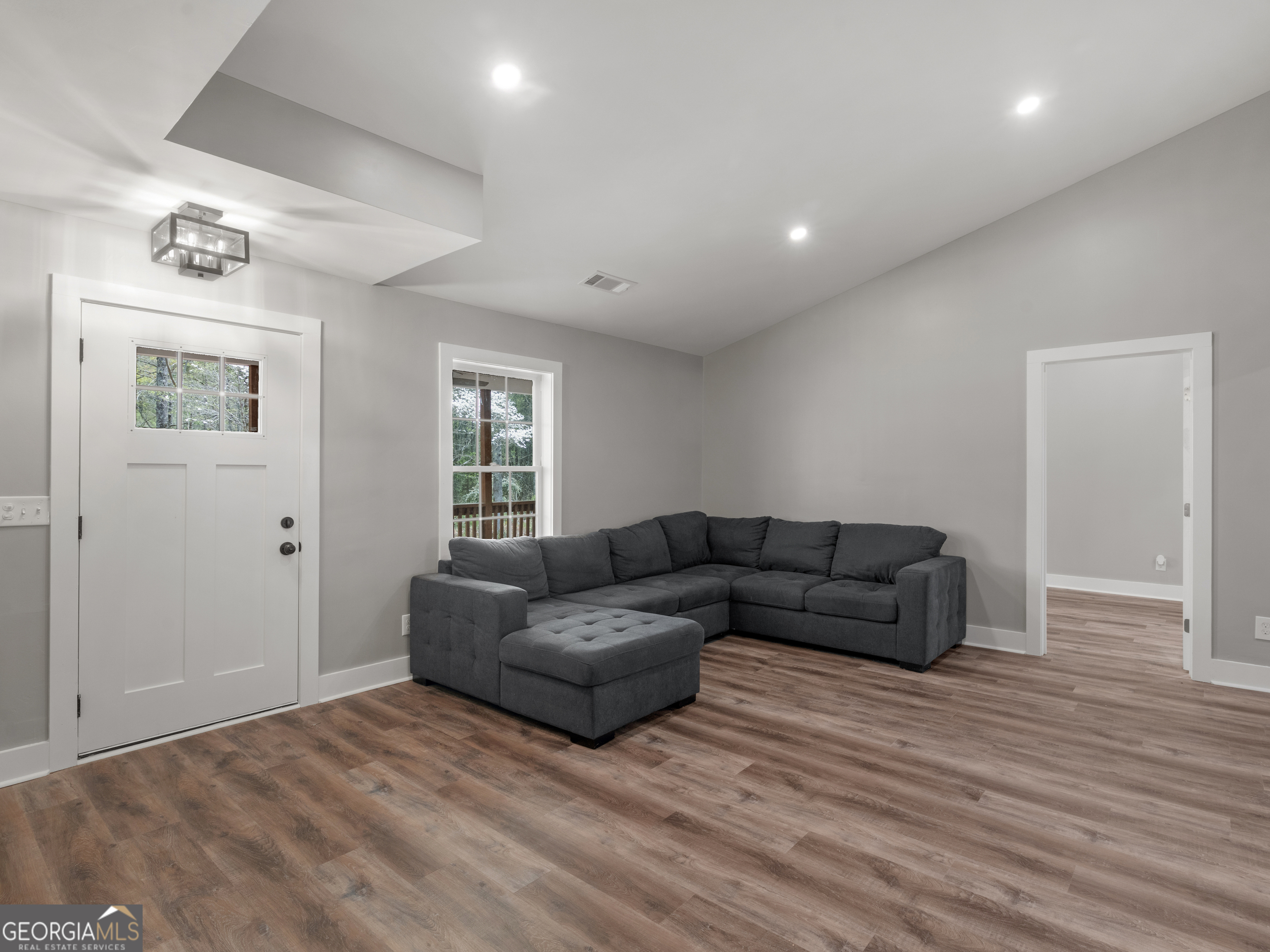 265 Steele Road Griffin, GA 30223 - Photo 6 of 64 a living room with furniture and a wooden floor