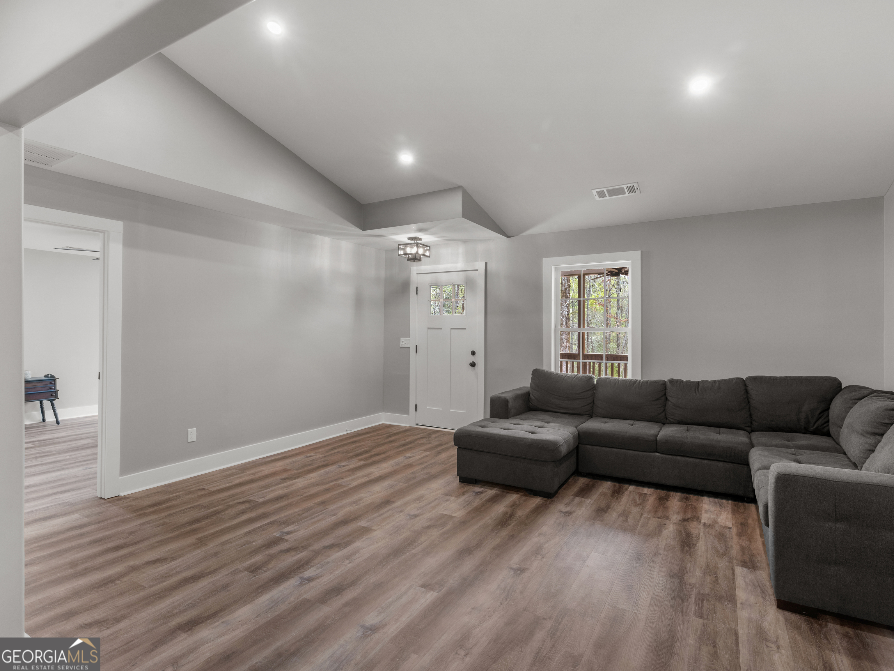 265 Steele Road Griffin, GA 30223 - Photo 7 of 64 a living room with furniture and wooden floor