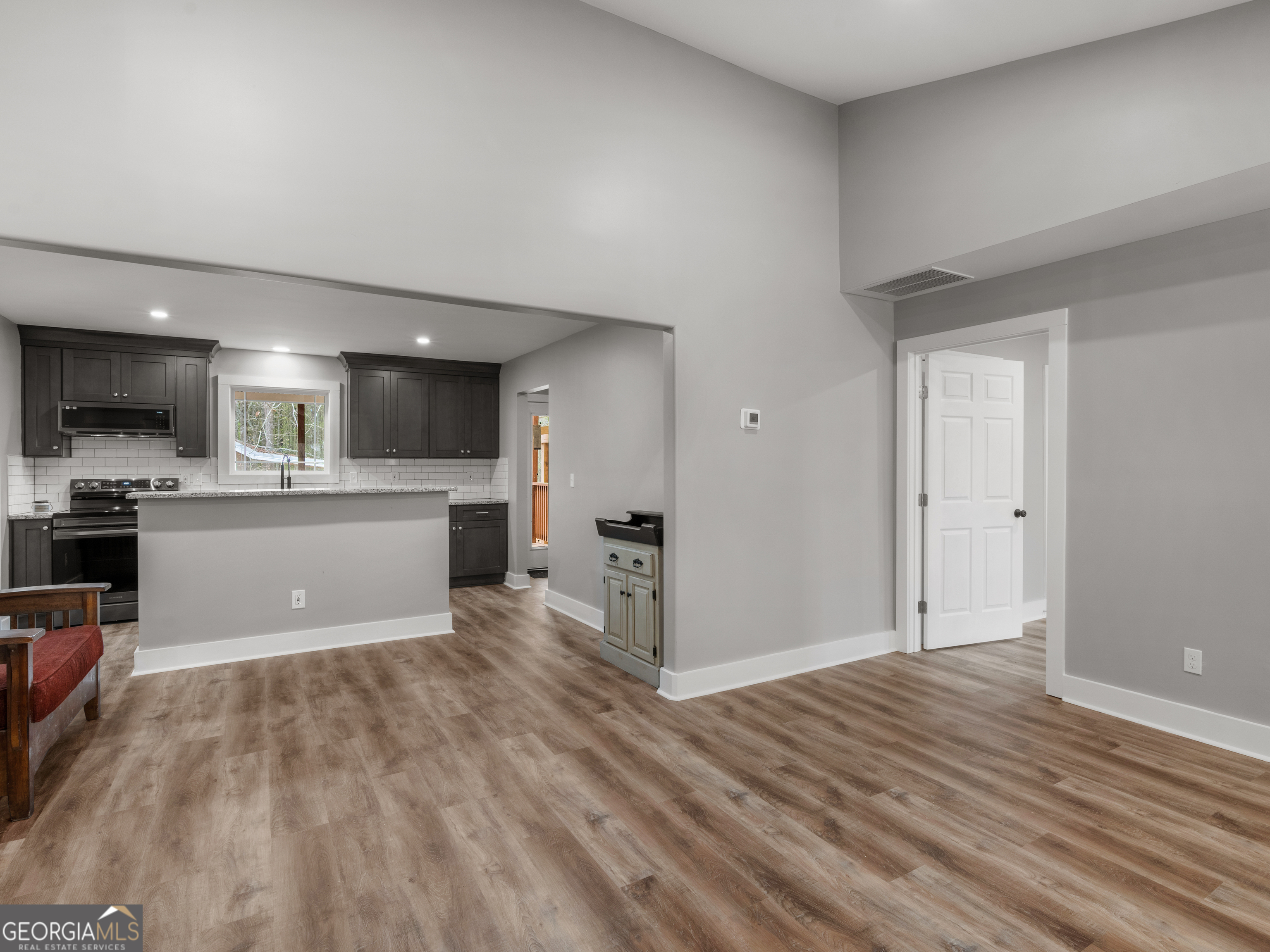 265 Steele Road Griffin, GA 30223 - Photo 8 of 64 a view of kitchen with wooden floor