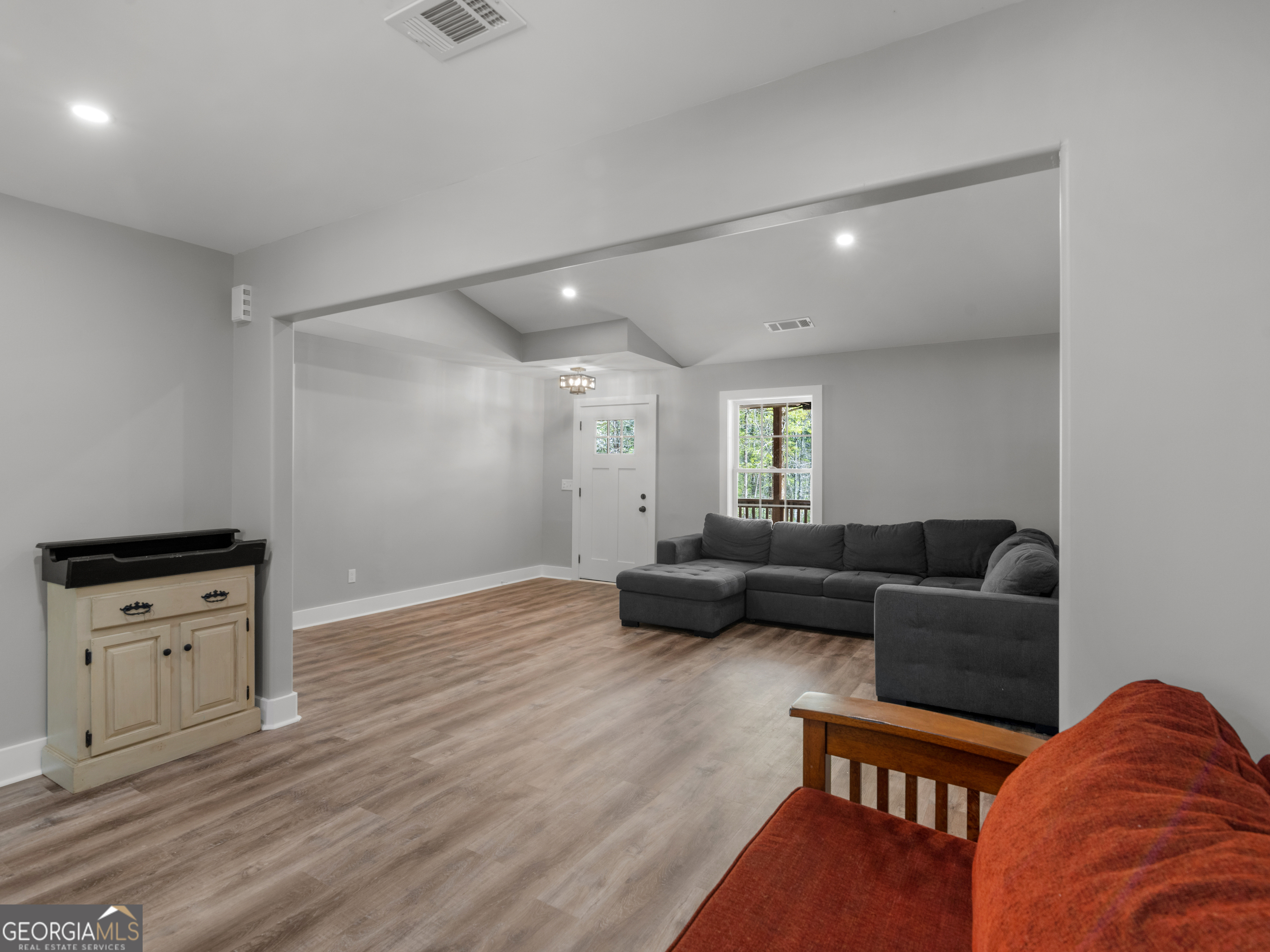 265 Steele Road Griffin, GA 30223 - Photo 10 of 64 a living room with furniture and a wooden floor