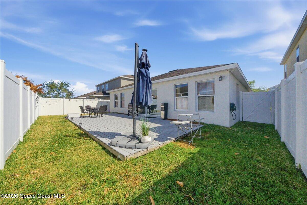 3258 Olivera Way St. Cloud, FL 34772 - Photo 29 of 30 a swimming pool with some trees in the background