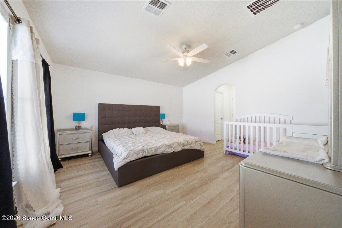 3258 Olivera Way St. Cloud, FL 34772 - Photo 9 of 30 a bedroom with a bed and a window