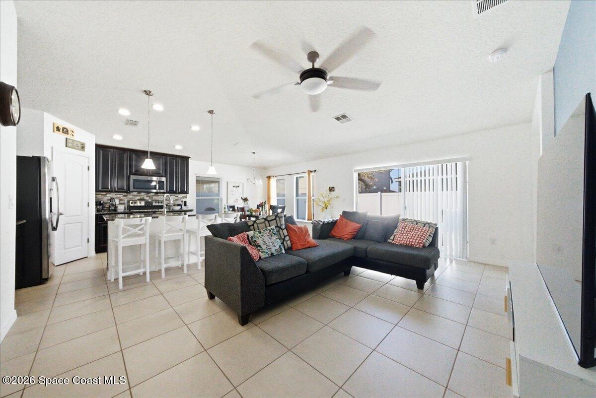 3258 Olivera Way St. Cloud, FL 34772 - Photo 30 of 30 a living room with furniture and kitchen view
