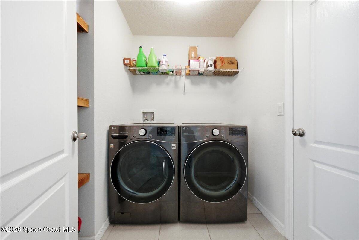3258 Olivera Way St. Cloud, FL 34772 - Photo 20 of 30 a utility room with dryer and washer