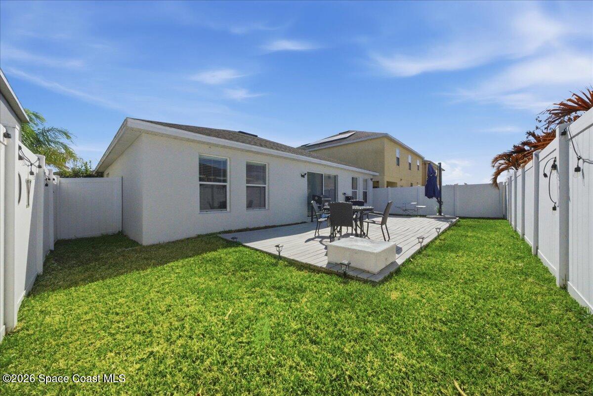 3258 Olivera Way St. Cloud, FL 34772 - Photo 8 of 30 a house view with a garden space