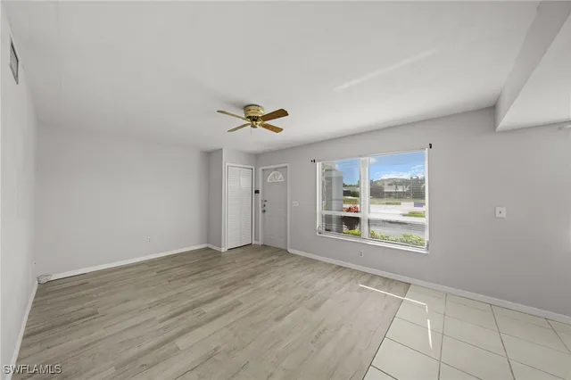 a view of an empty room with a window