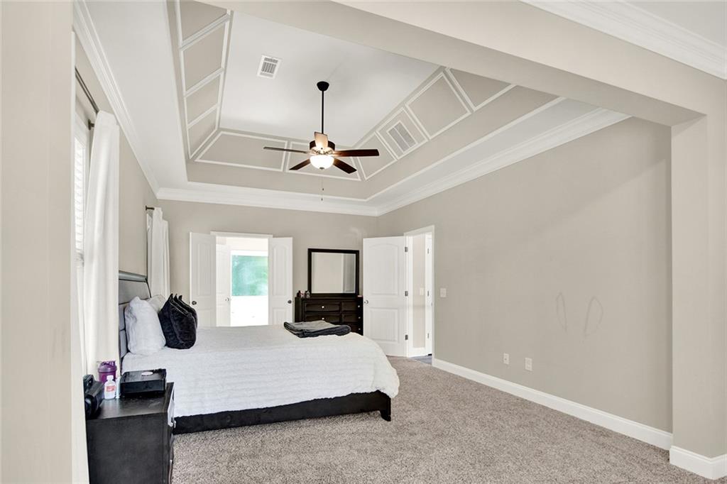 407 Corinth Church Road Winder, GA 30680 - Photo 38 of 66 a living room with kitchen island furniture and a chandelier
