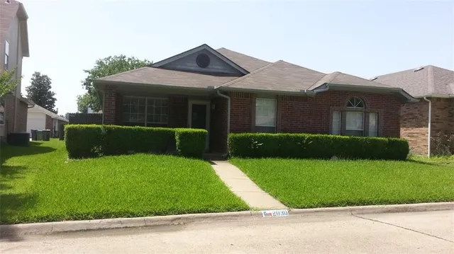 front view of a house with a yard