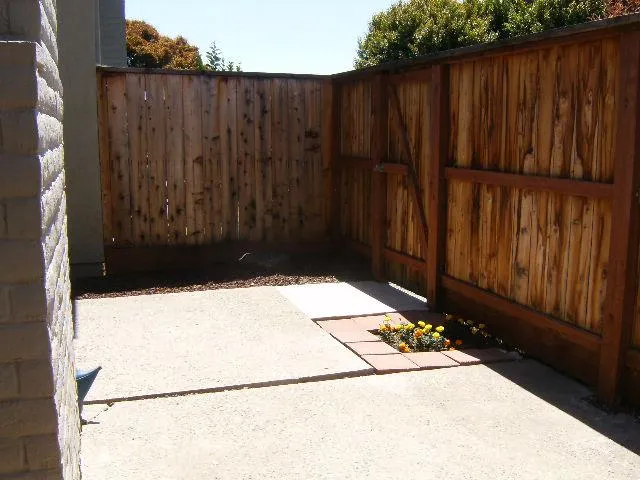 a view of outdoor space with wooden fence