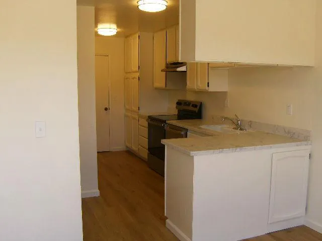 a view of a kitchen with a sink