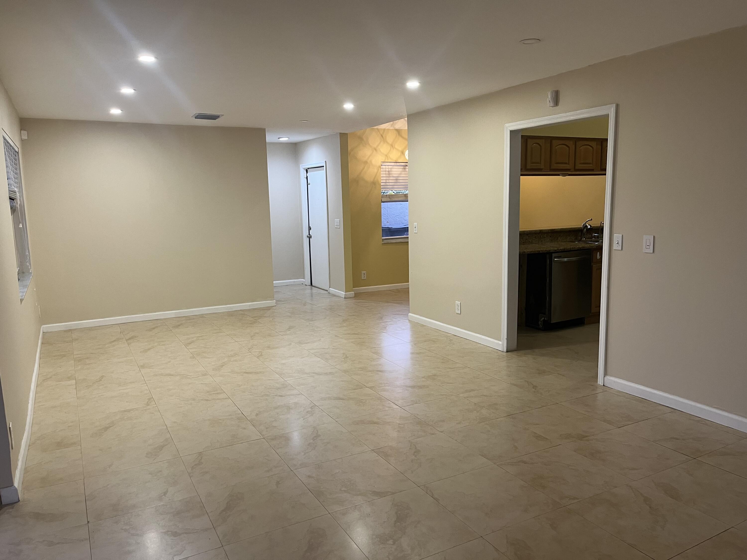 7420 Champagne Place Boca Raton, FL 33433 - Photo 12 of 32 an empty room with an entryway and an empty room