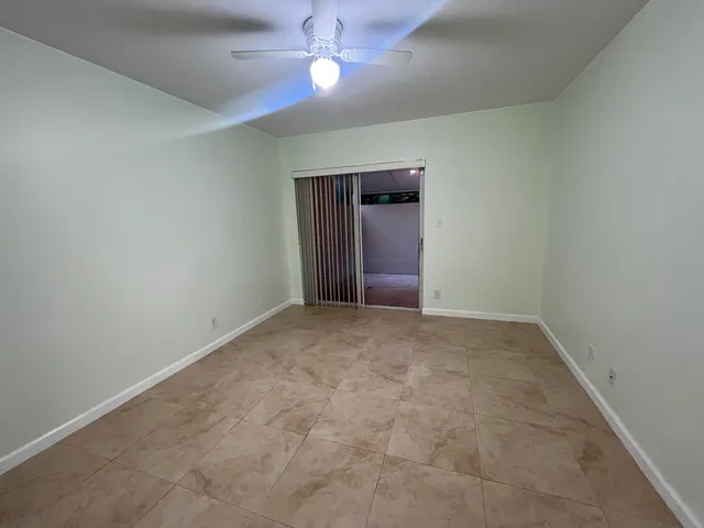 a view of a bathroom with a shower and a window
