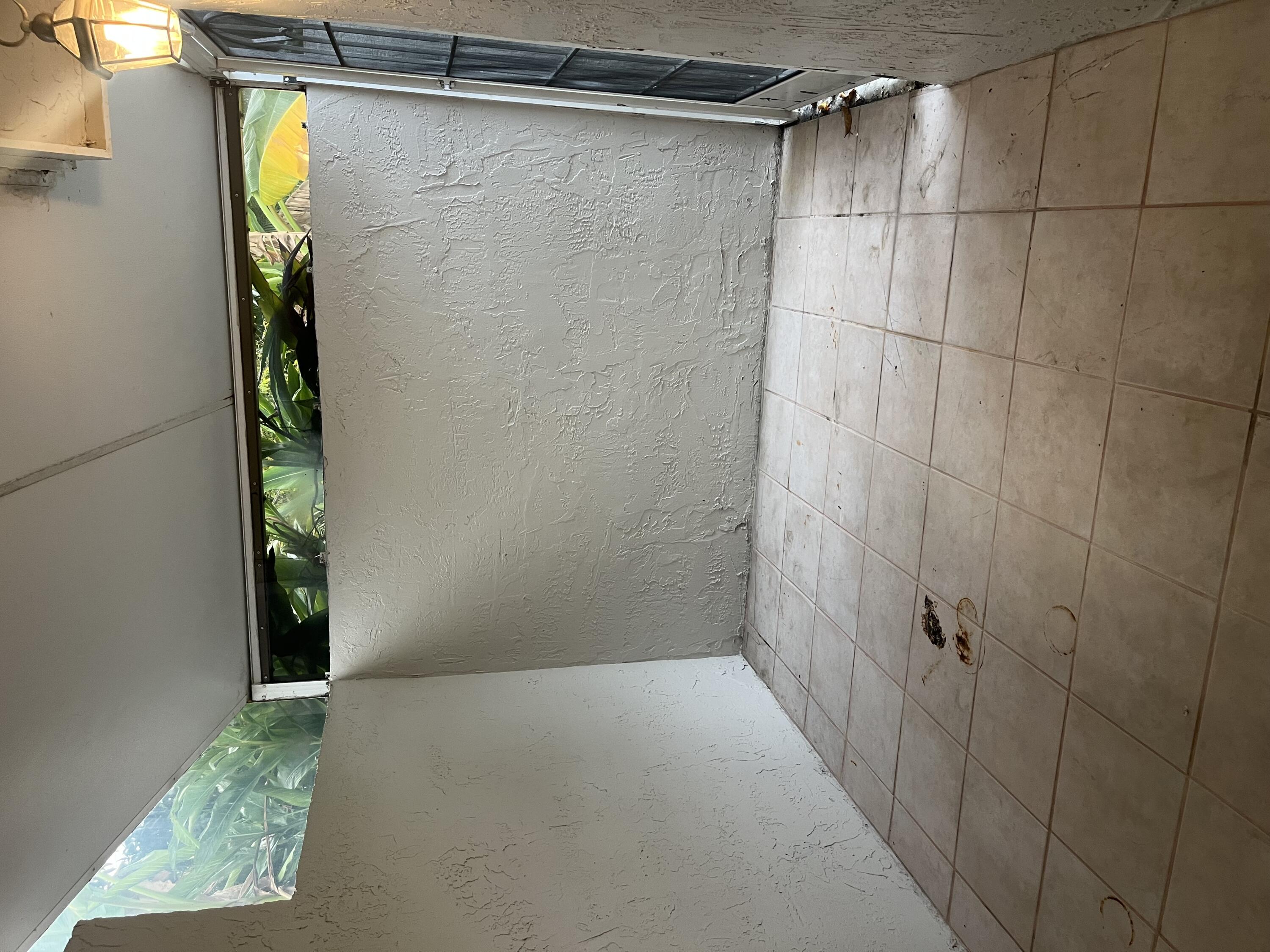 7420 Champagne Place Boca Raton, FL 33433 - Photo 18 of 32 a view of a bathroom with a shower and a window