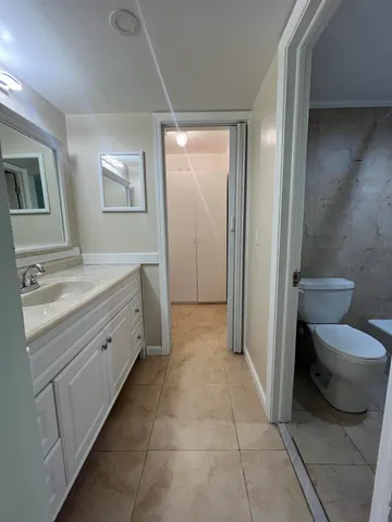 a view of room with wooden floor and closet