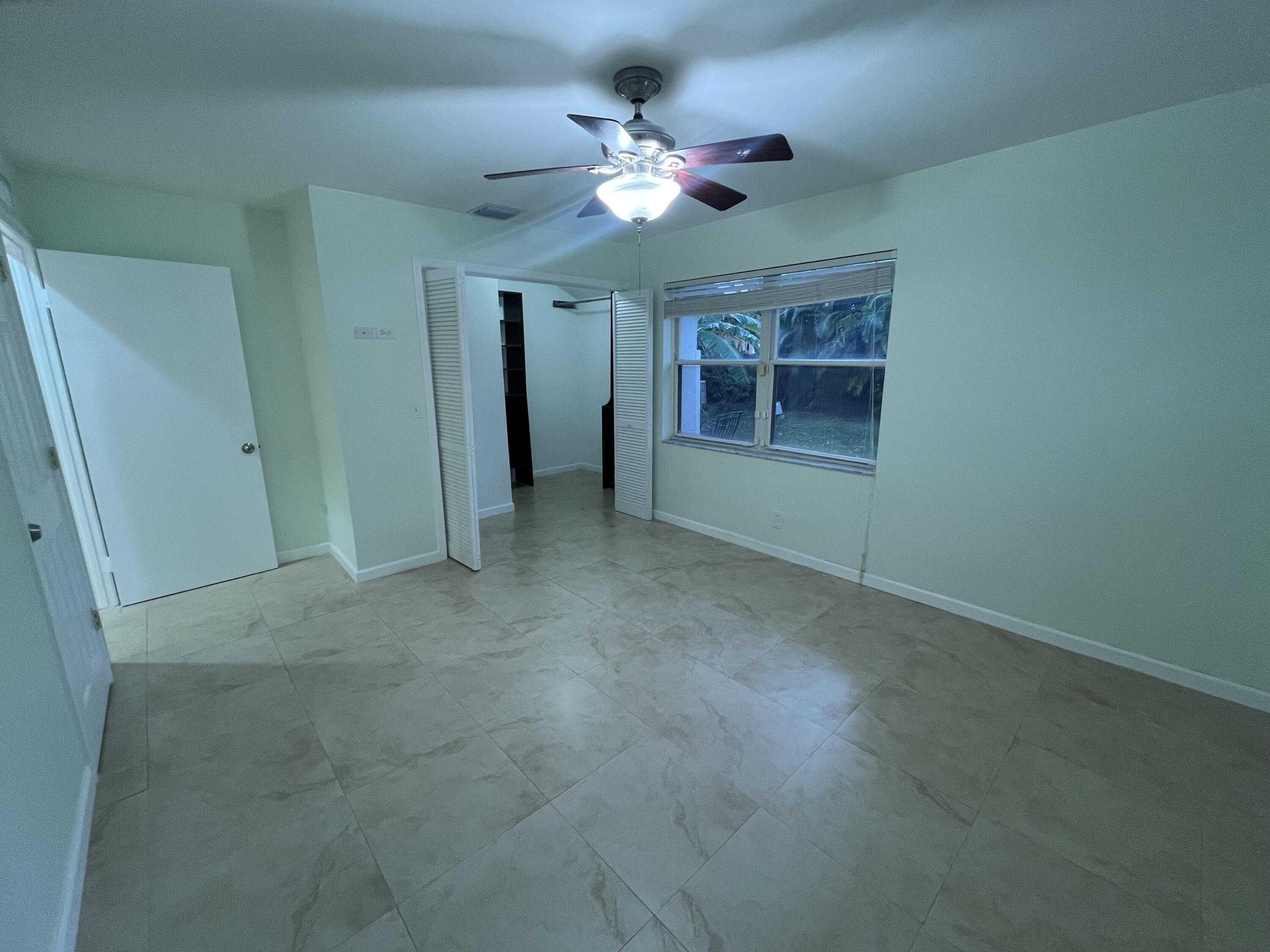 7420 Champagne Place Boca Raton, FL 33433 - Photo 24 of 32 a view of an empty room with a window