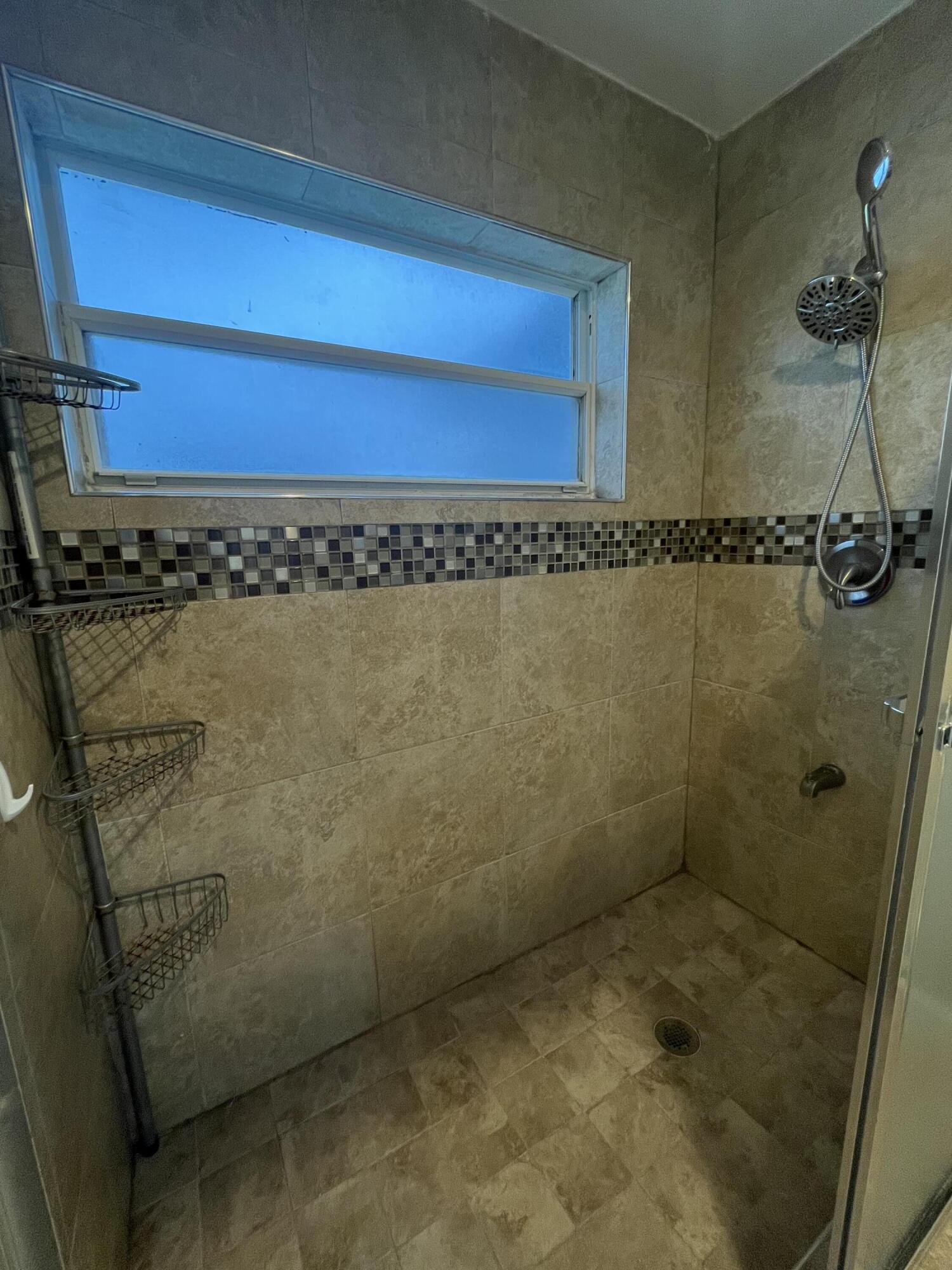 7420 Champagne Place Boca Raton, FL 33433 - Photo 30 of 32 a bathroom with a shower