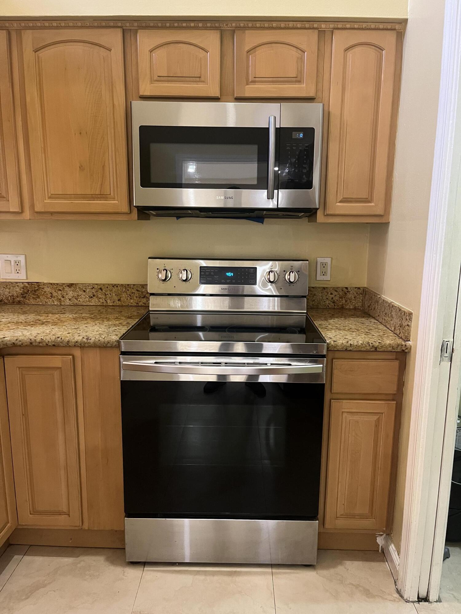 7420 Champagne Place Boca Raton, FL 33433 - Photo 6 of 32 a stove top oven sitting inside of a kitchen
