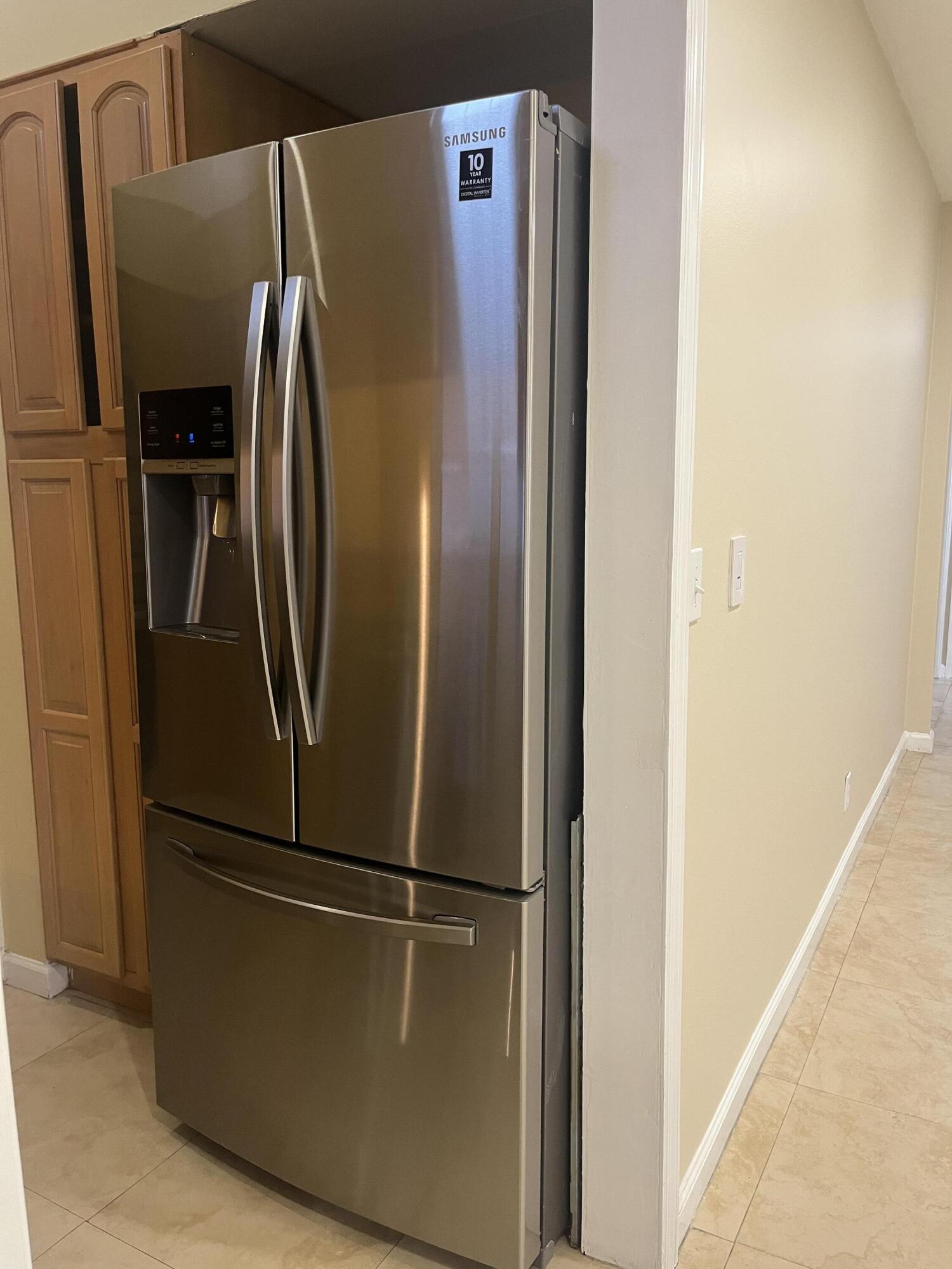 7420 Champagne Place Boca Raton, FL 33433 - Photo 7 of 32 a metallic refrigerator freezer sitting in a kitchen