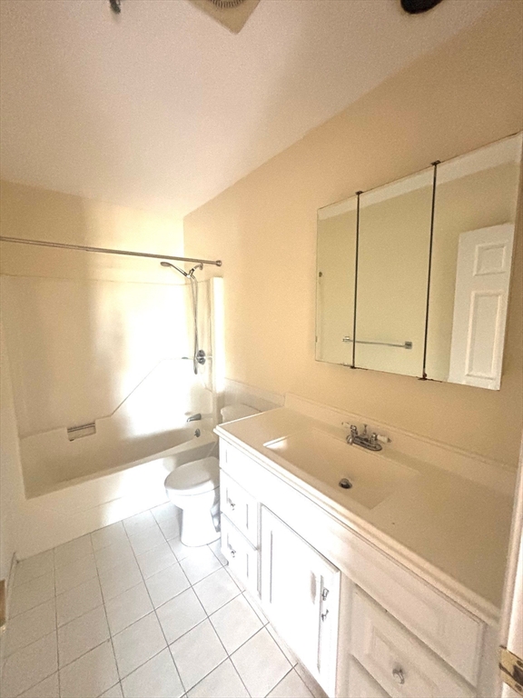 3920 Mystic Valley Parkway, Unit 115 Medford, MA 02155 - Photo 13 of 27 a bathroom with a bathtub and a sink