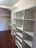 3920 Mystic Valley Parkway, Unit 115 Medford, MA 02155 - Photo 15 of 27 a view of walk in closet with empty racks