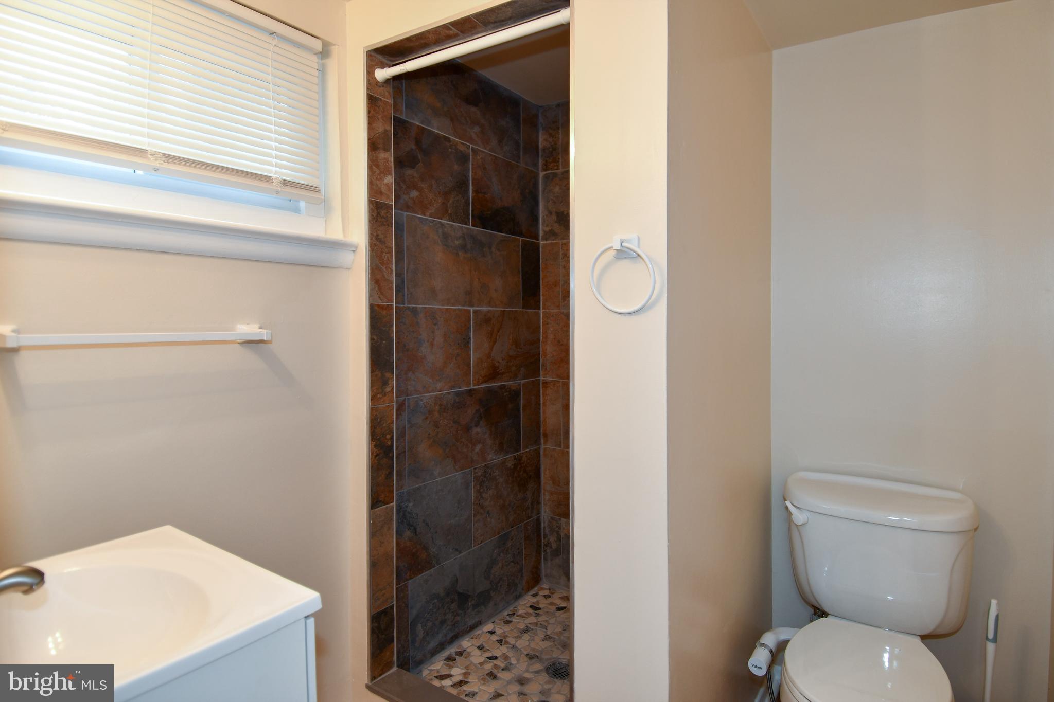 10304 Inwood Avenue Silver Spring, MD 20902 - Photo 19 of 24 a bathroom with a toilet and a shower