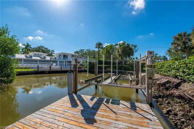a view of a swimming pool with lounge chairs