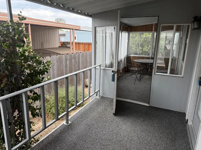 a room with chairs and a window