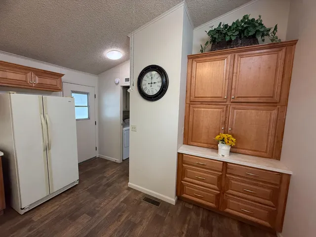 a kitchen with a sink and a stove top oven